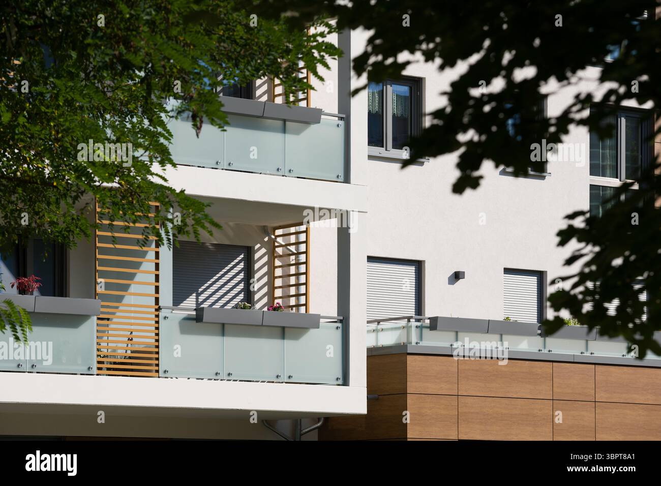 Exterior of a modern apartment building on a sunny day. The facade ... - Pertaining Apricates Apartment Design Glass Railings