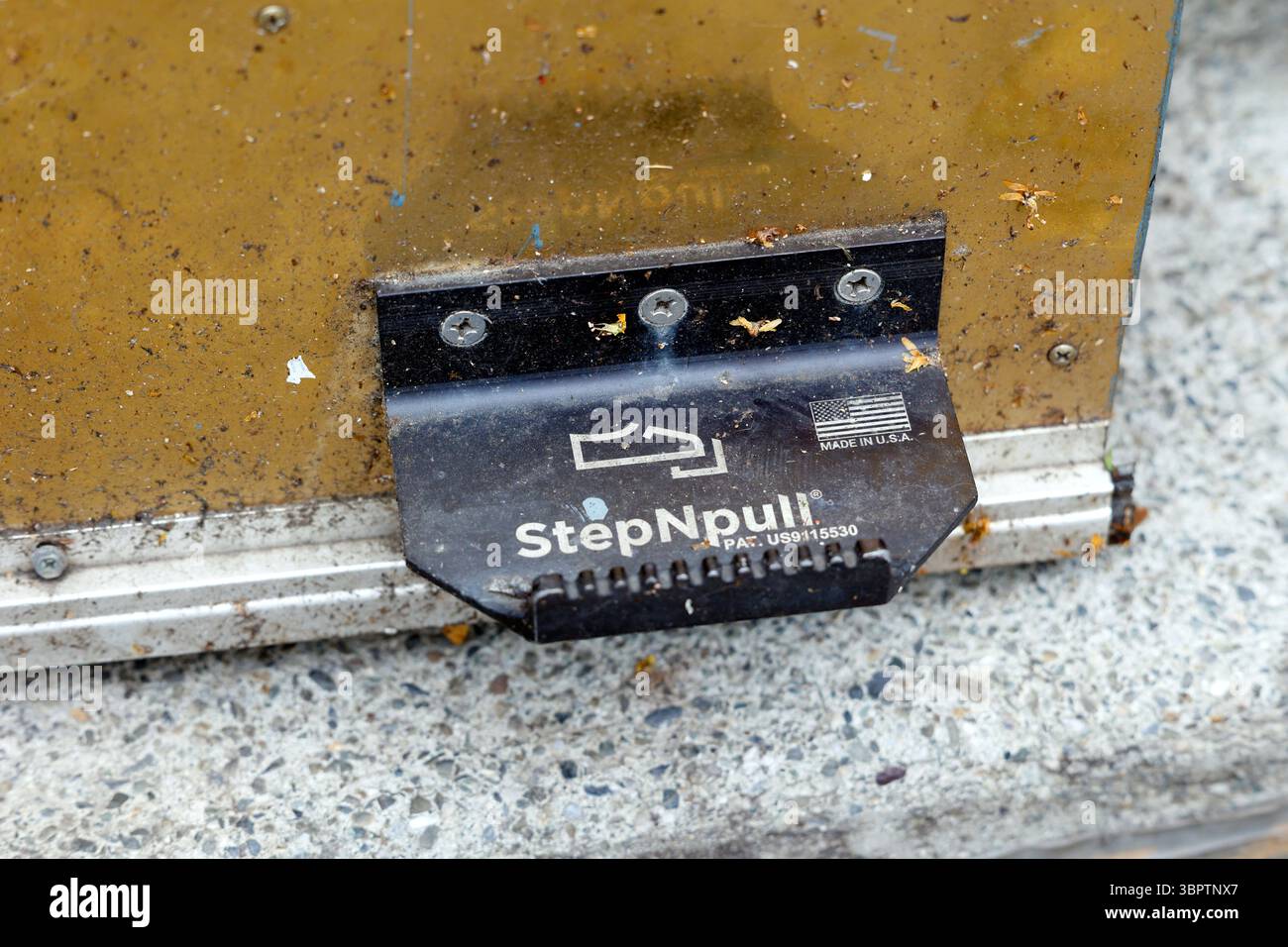 A StepNPull hands free, foot operated door opener, door pull Stock Photo