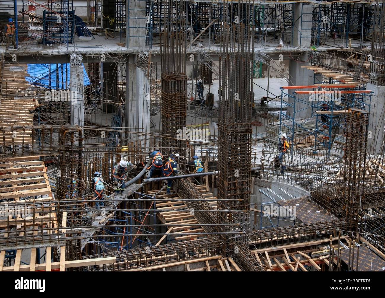 Workmen on construction building site Stock Photo