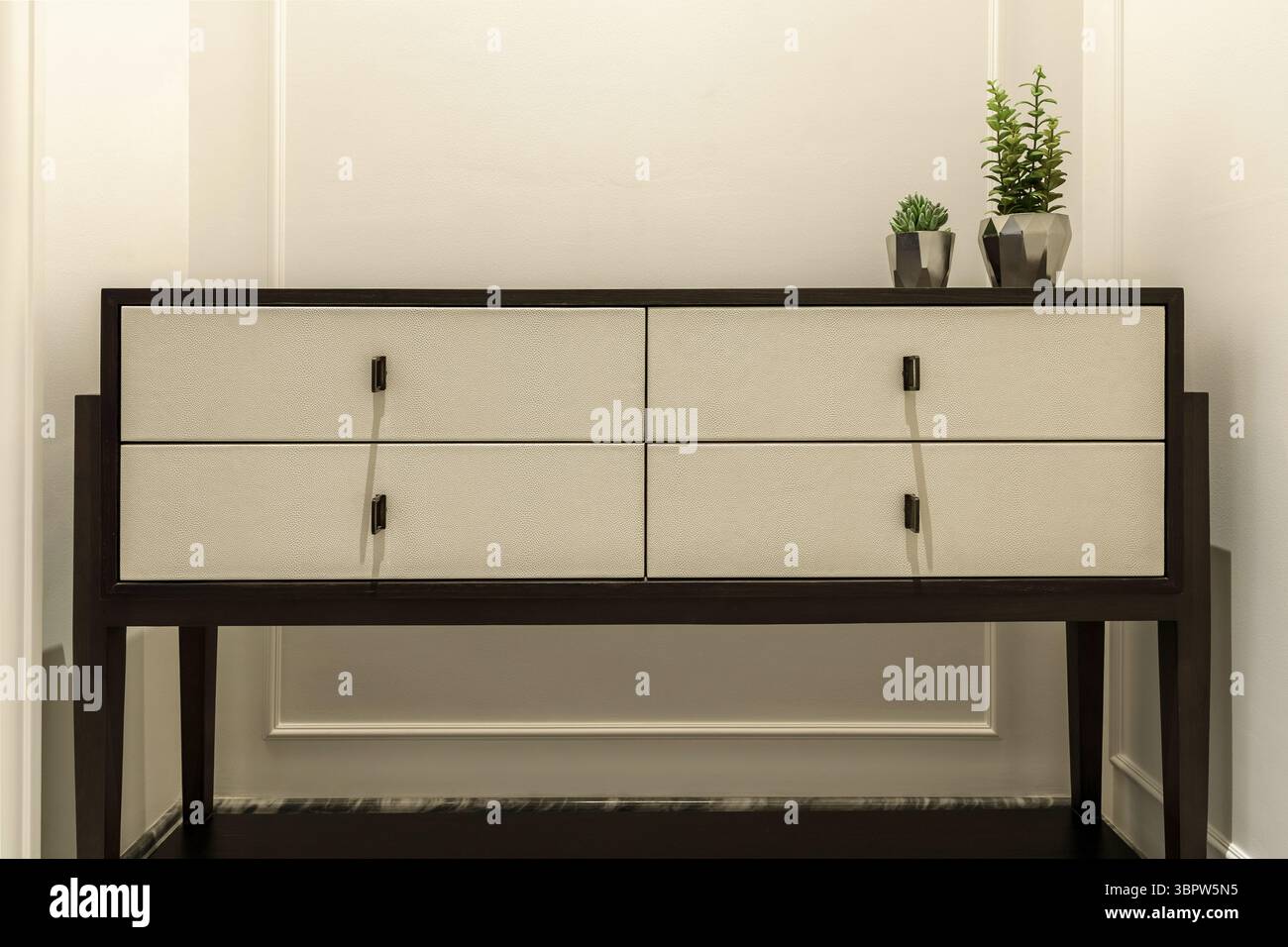 Stylish hallway with a modern dark wood and shagreen console table ...