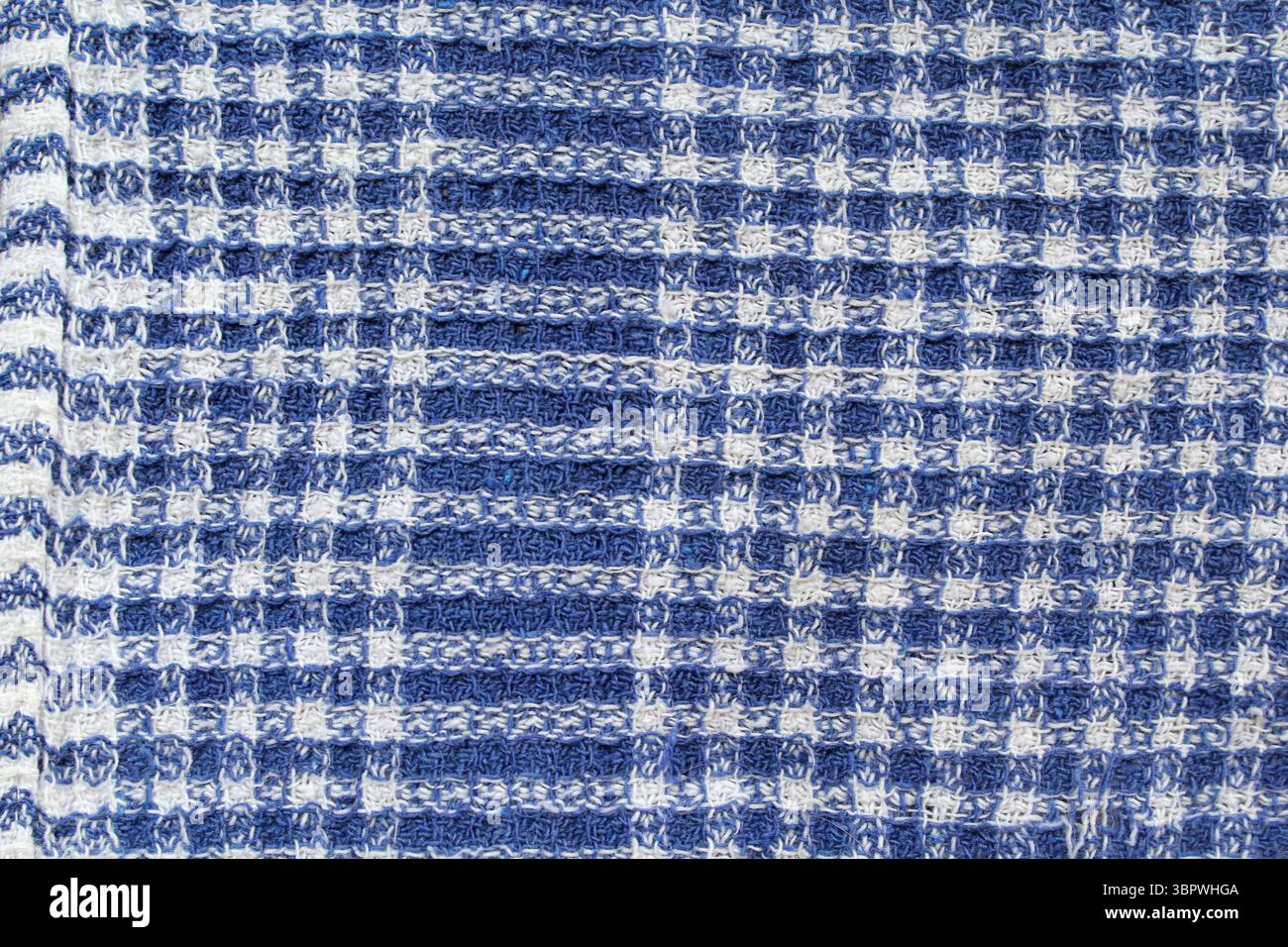 Blue and white checked pattern cloth fabric textured close up background Stock Photo