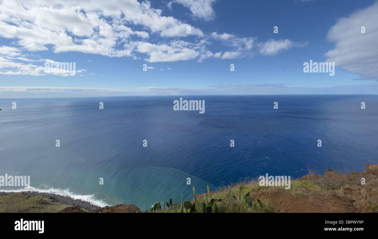 Beautiful blue ocean and sky create a scenic and peaceful coastal landscape in Madeira, Portugal - Smartphone Captured Stock Image