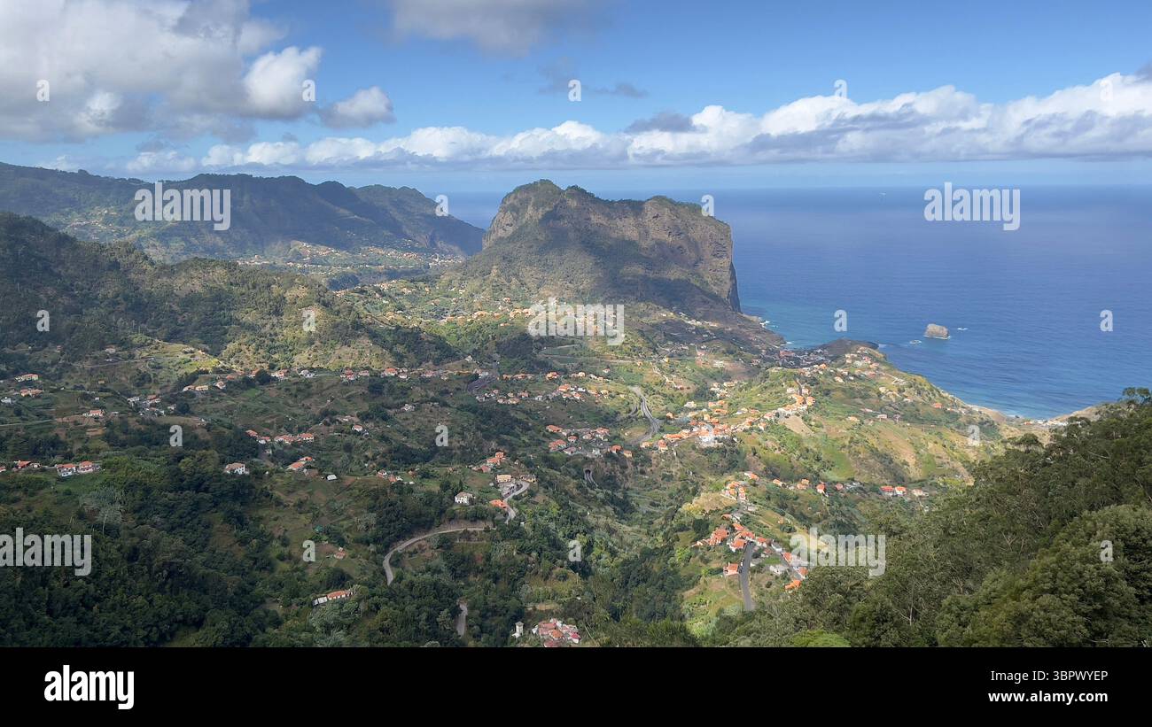 Mountains meeting the ocean on a bright day, Madeira Portugal - Smartphone Captured Stock Image