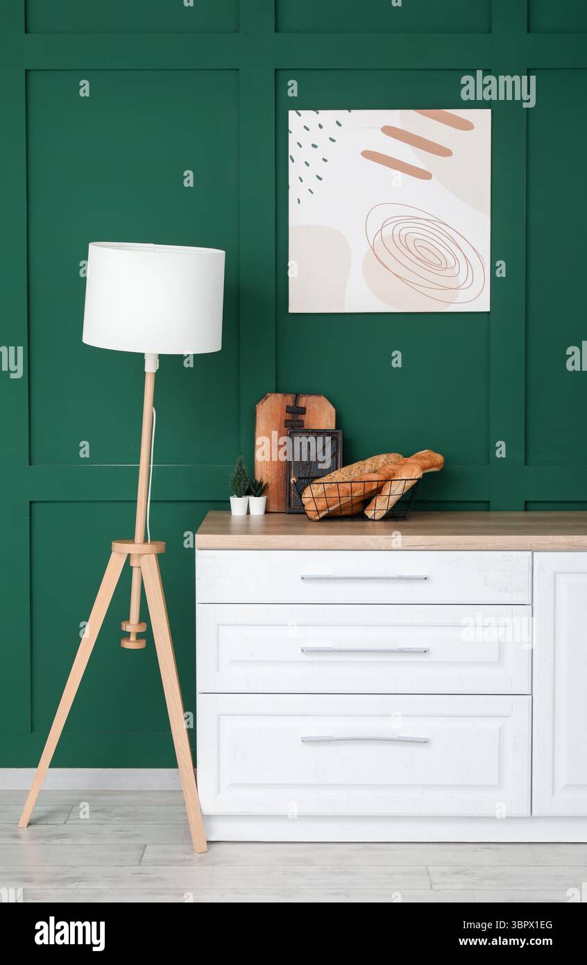 Interior of modern kitchen with white counters and lamp Stock Photo - Alamy