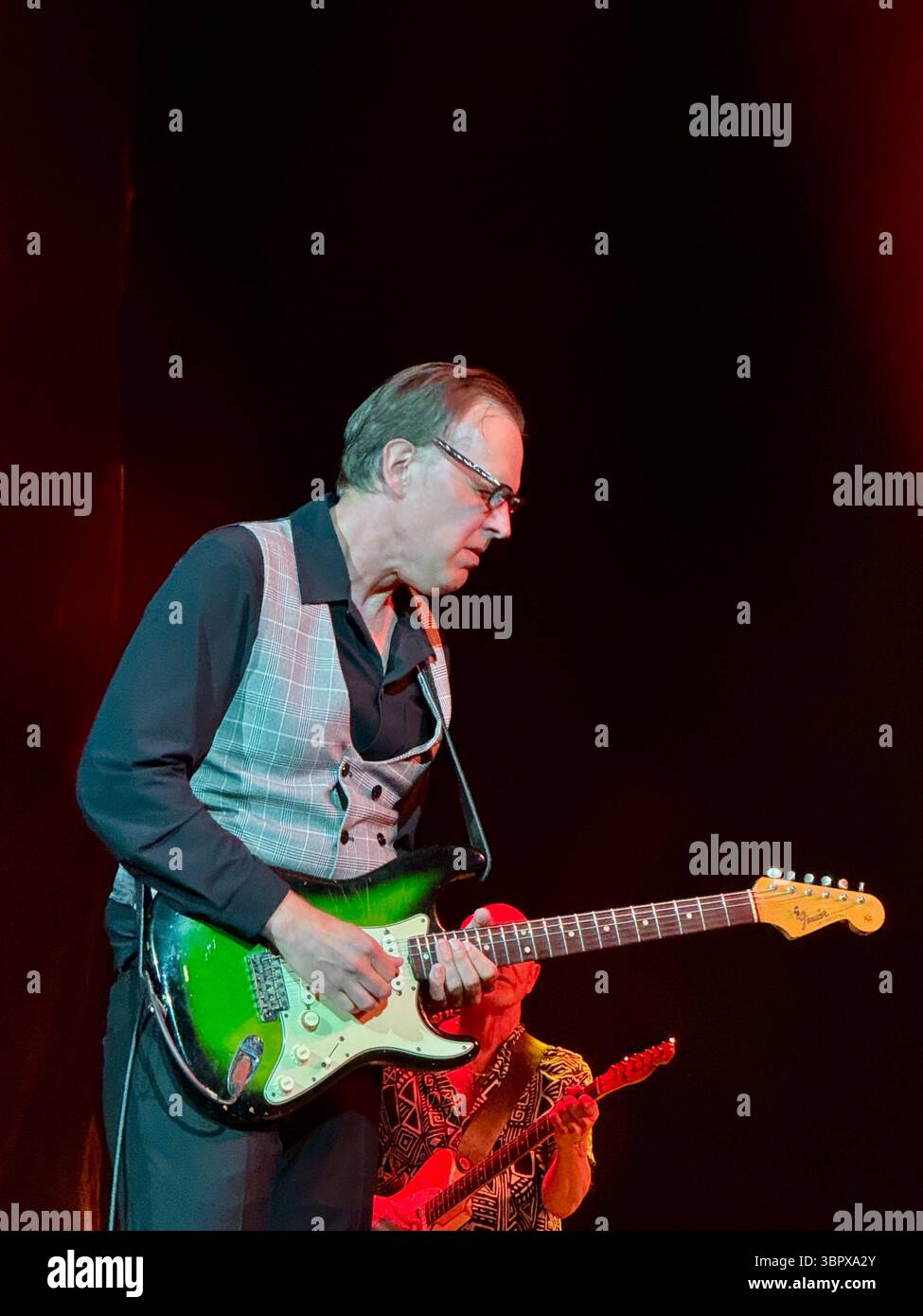 Blues guitarist Joe Bonamassa playing a Fender Stratocaster in concert performing Rory Gallagher songs in Cork for the 30th anniversary of his death - Smartphone Captured Stock Image