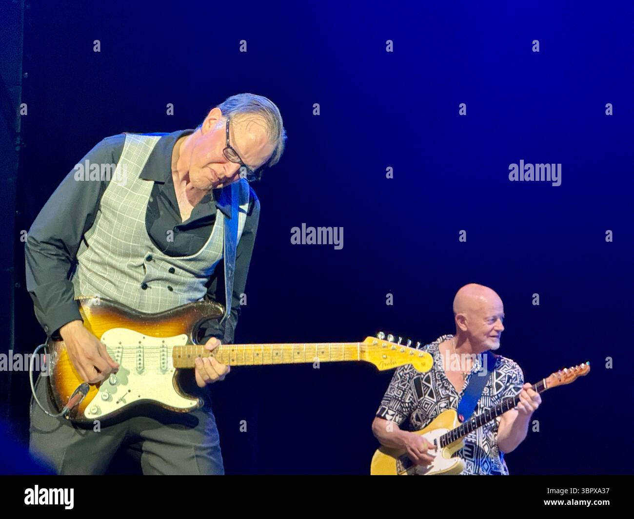 Blues guitarist Joe Bonamassa playing a Fender Stratocaster in concert performing Rory Gallagher songs in Cork for the 30th anniversary of his death - Smartphone Captured Stock Image