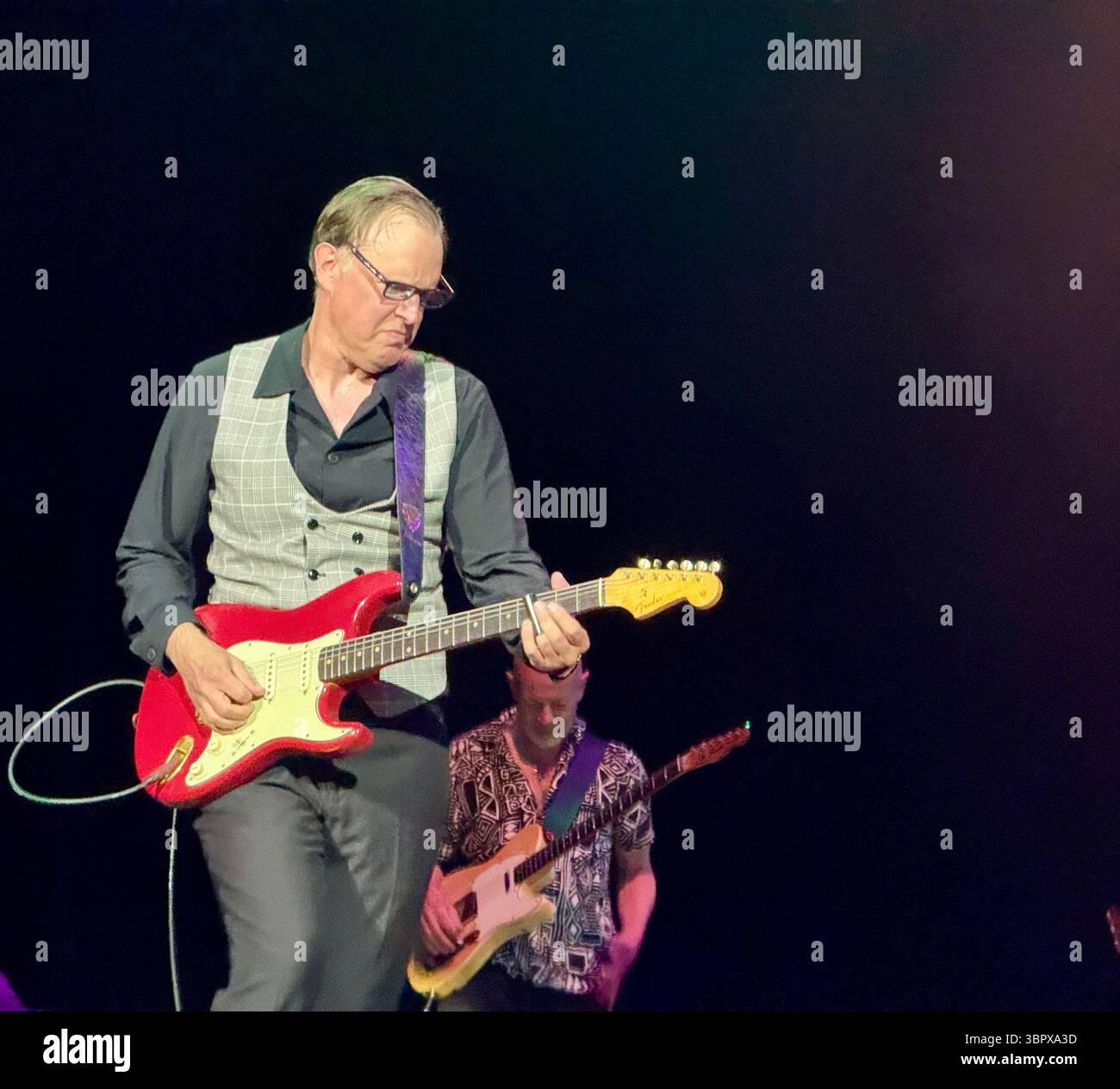 Blues guitarist Joe Bonamassa playing a Fender Stratocaster in concert performing Rory Gallagher songs in Cork for the 30th anniversary of his death - Smartphone Captured Stock Image