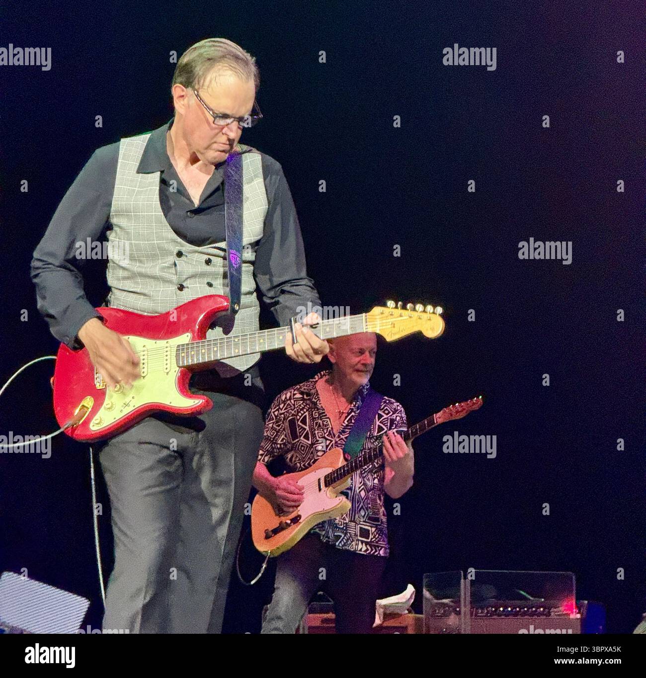 Blues guitarist Joe Bonamassa playing a Fender Stratocaster in concert performing Rory Gallagher songs in Cork for the 30th anniversary of his death - Smartphone Captured Stock Image