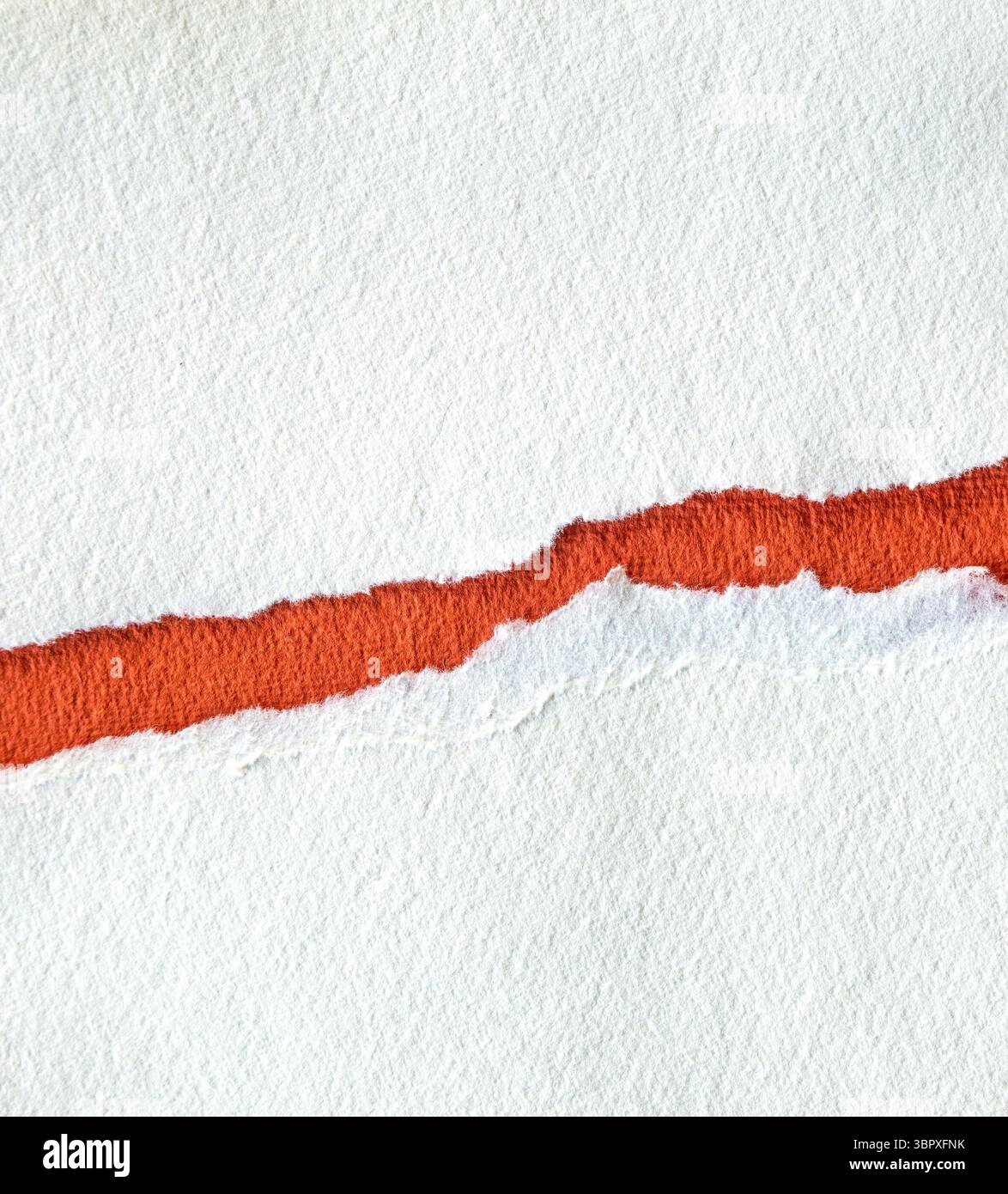 Torn textured red and white paper background with copy space Stock Photo