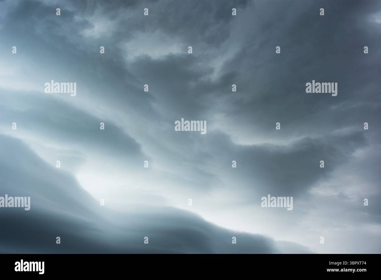 Gray Nimbostratus clouds against sky Stock Photo