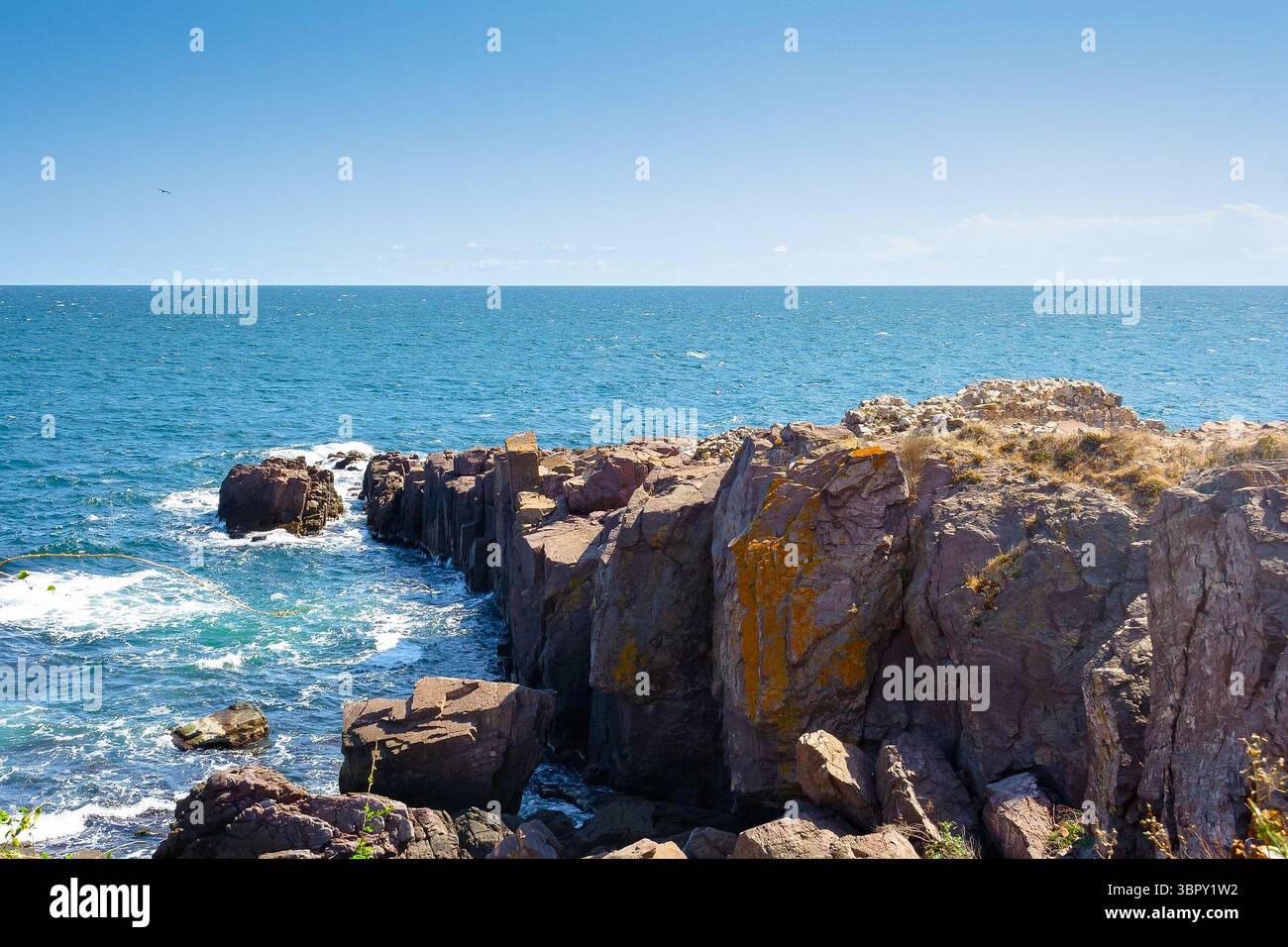 landscape with sea and coast with rock. vacation season with beautiful seascape in summer. travel background with water splash on stone Stock Photo