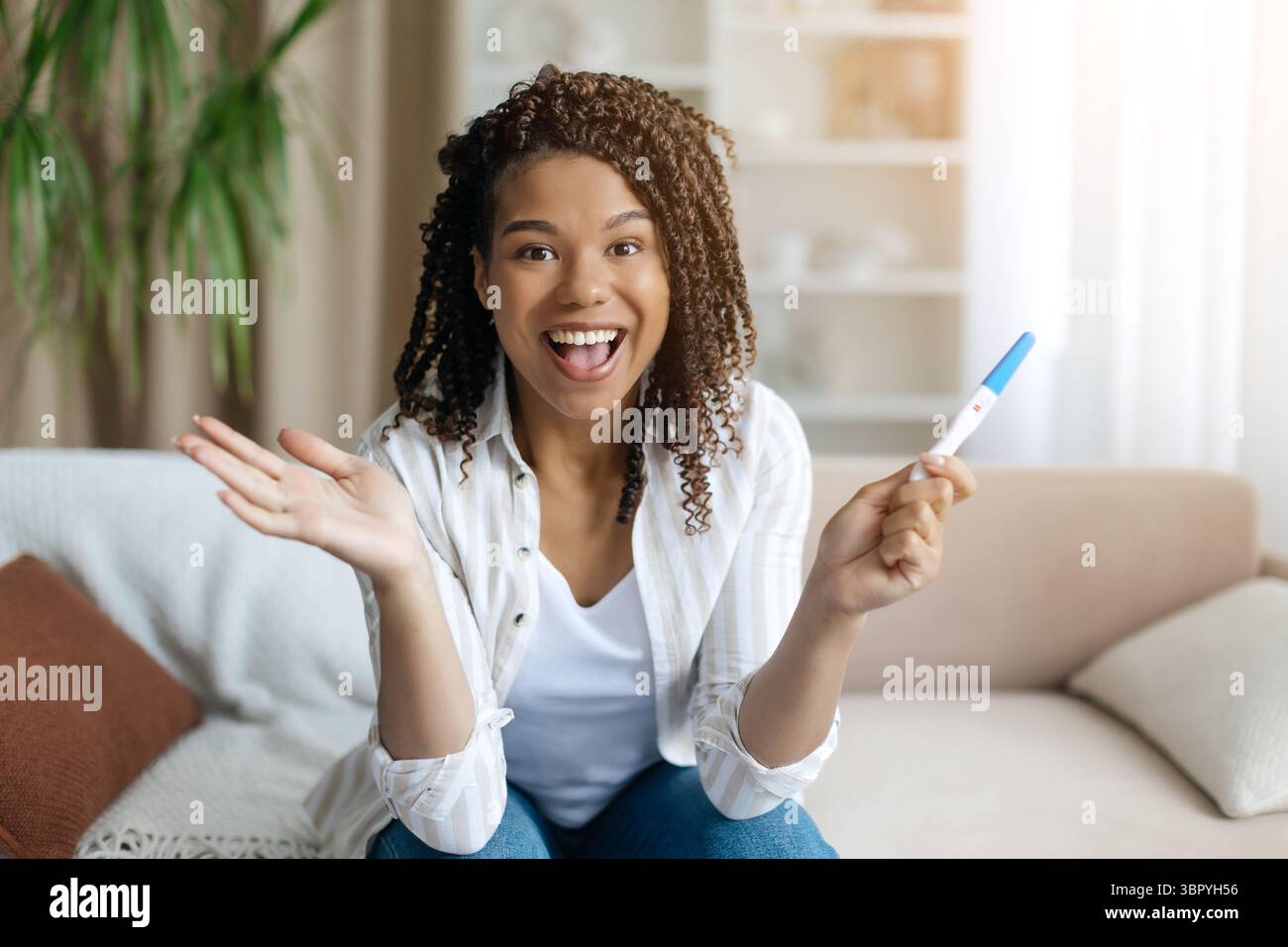 Happy black woman reacting positive hi-res stock photography and images ...