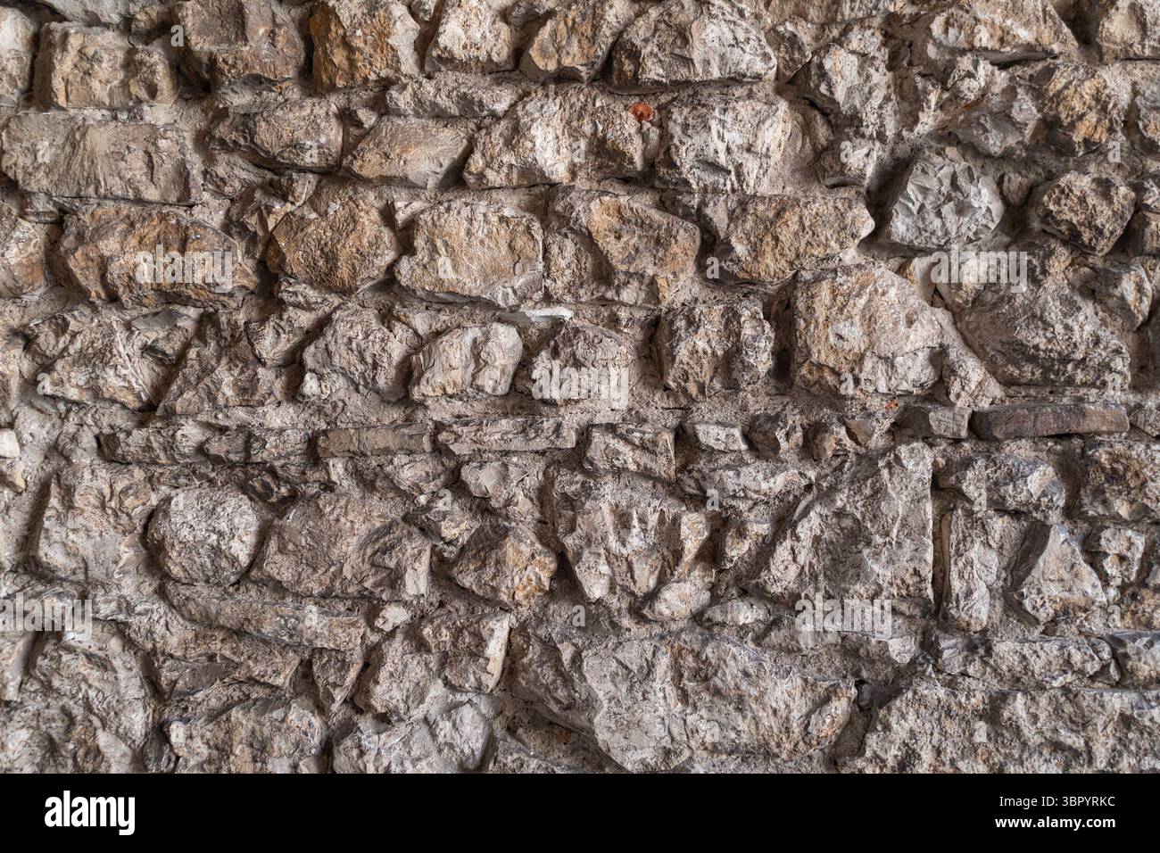Rustic stone wall texture with natural rough surfaces and variations ...