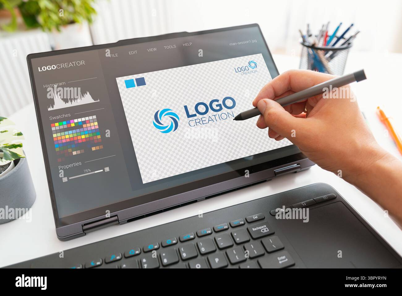 Graphic designer logo creator on screen. Laptop 2 in 1 device Stock ...