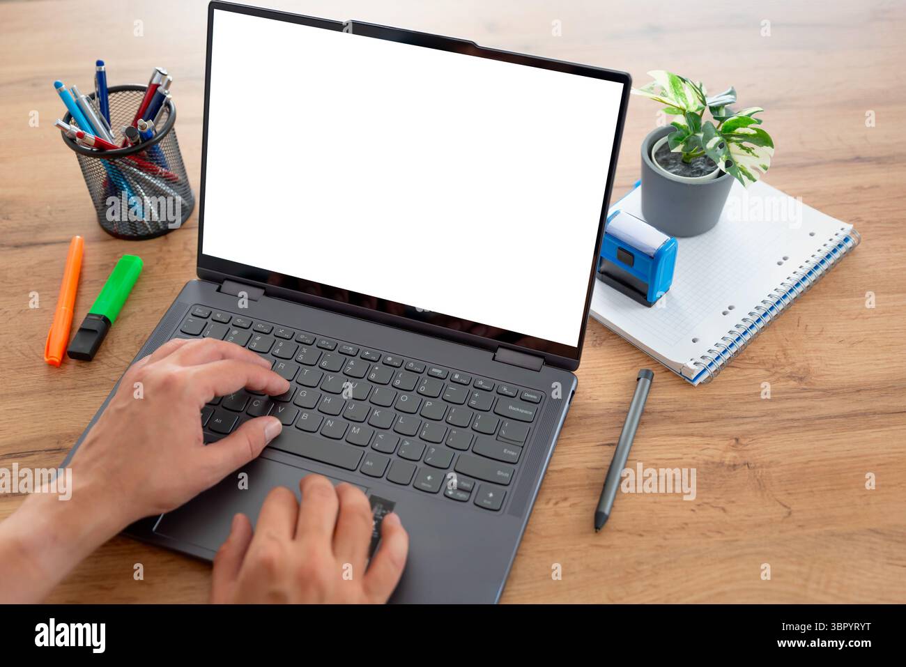 Man using laptop with blank screen, copy space Stock Photo