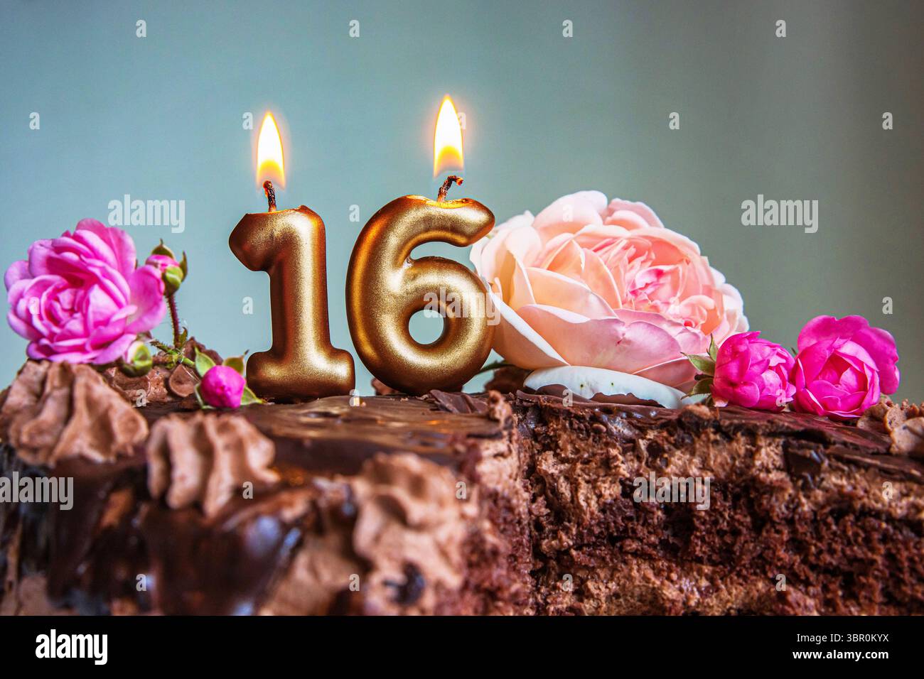 Sweet 16 Pink Roses Chocolate cake roses candle light hi-res stock photography and images ...