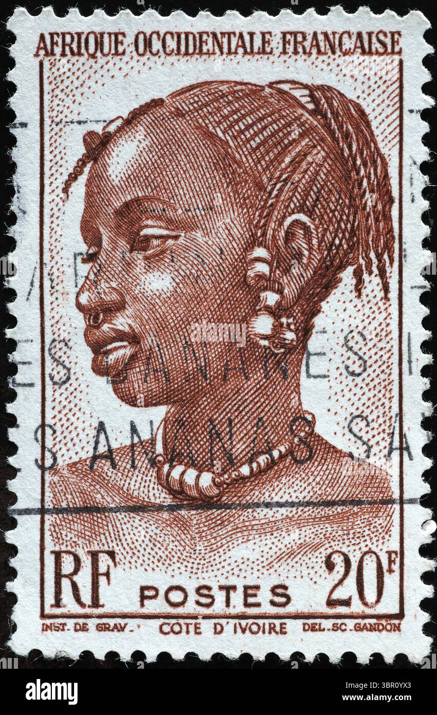 Woman portrait on vintage stamp of Ivory Coast Stock Photo