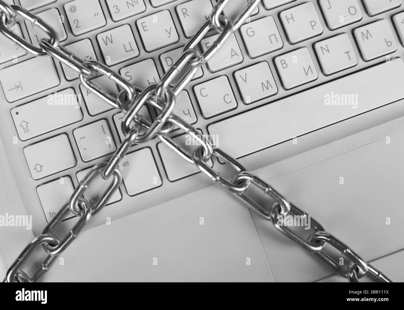 Laptop with chains close up Stock Photo - Alamy