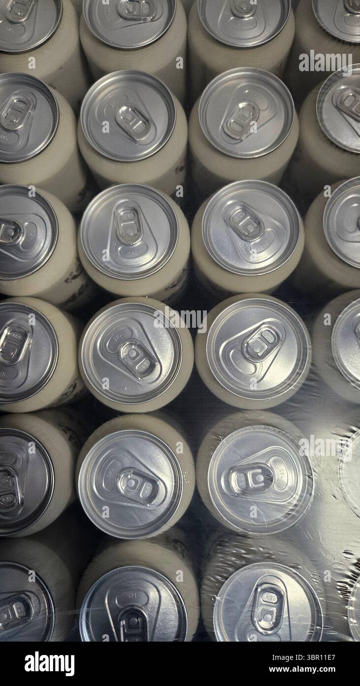 Top View of Aluminum Cans in Plastic Wrap Packaging - Smartphone Captured Stock Image