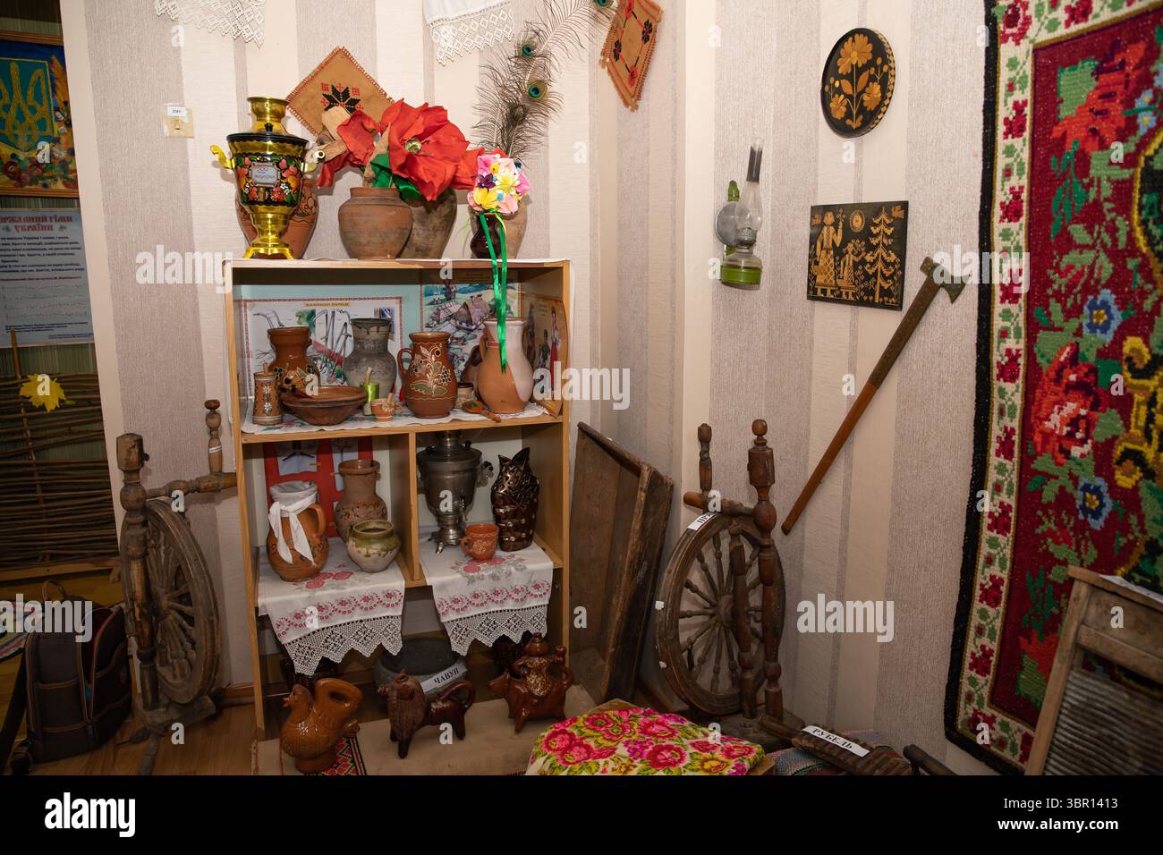Wooden shelves display hand-painted pottery, a decorative samovar ...