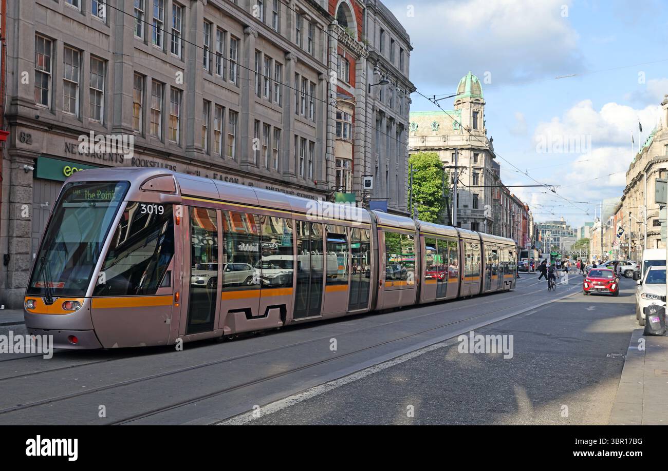 Luas Red Line tram number 3019 travelling through O’Connell Street in Dublin city centre, Ireland, en route to The Point, serving the Docklands and 3A Stock Photo