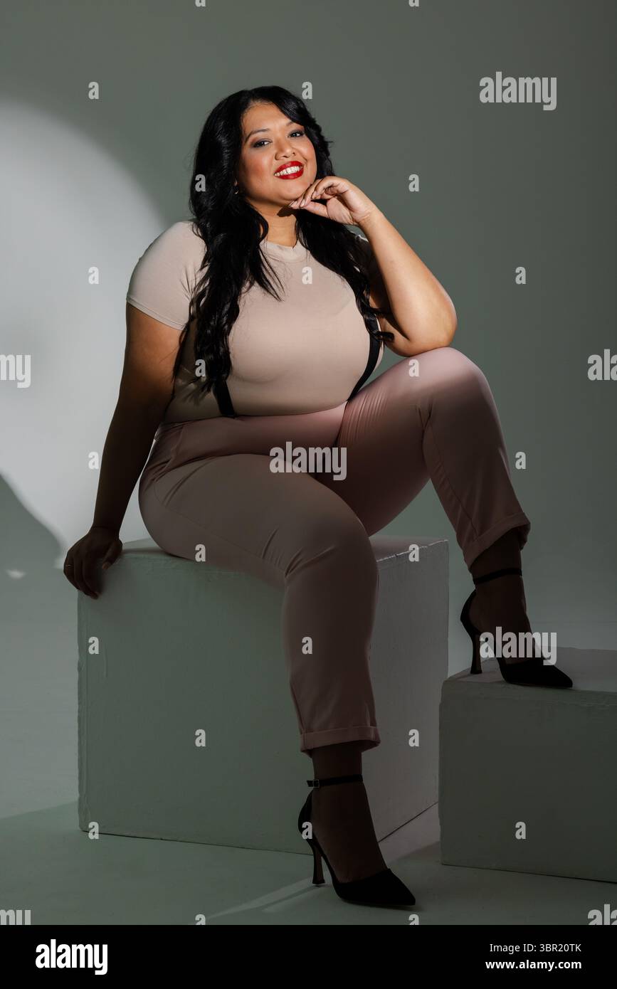Female wearing beige top hi-res stock photography and images - Alamy