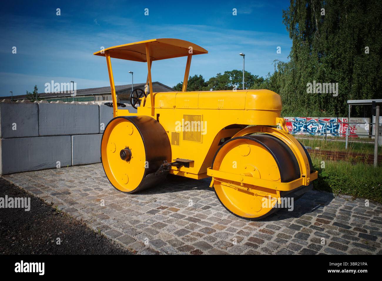 An old yellow historic levelling roller Stock Photo