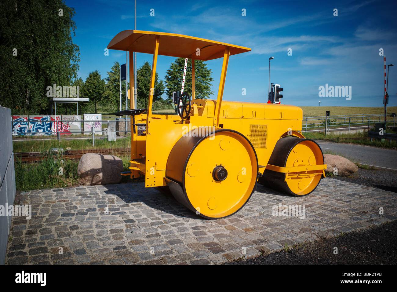 An old yellow historic levelling roller Stock Photo