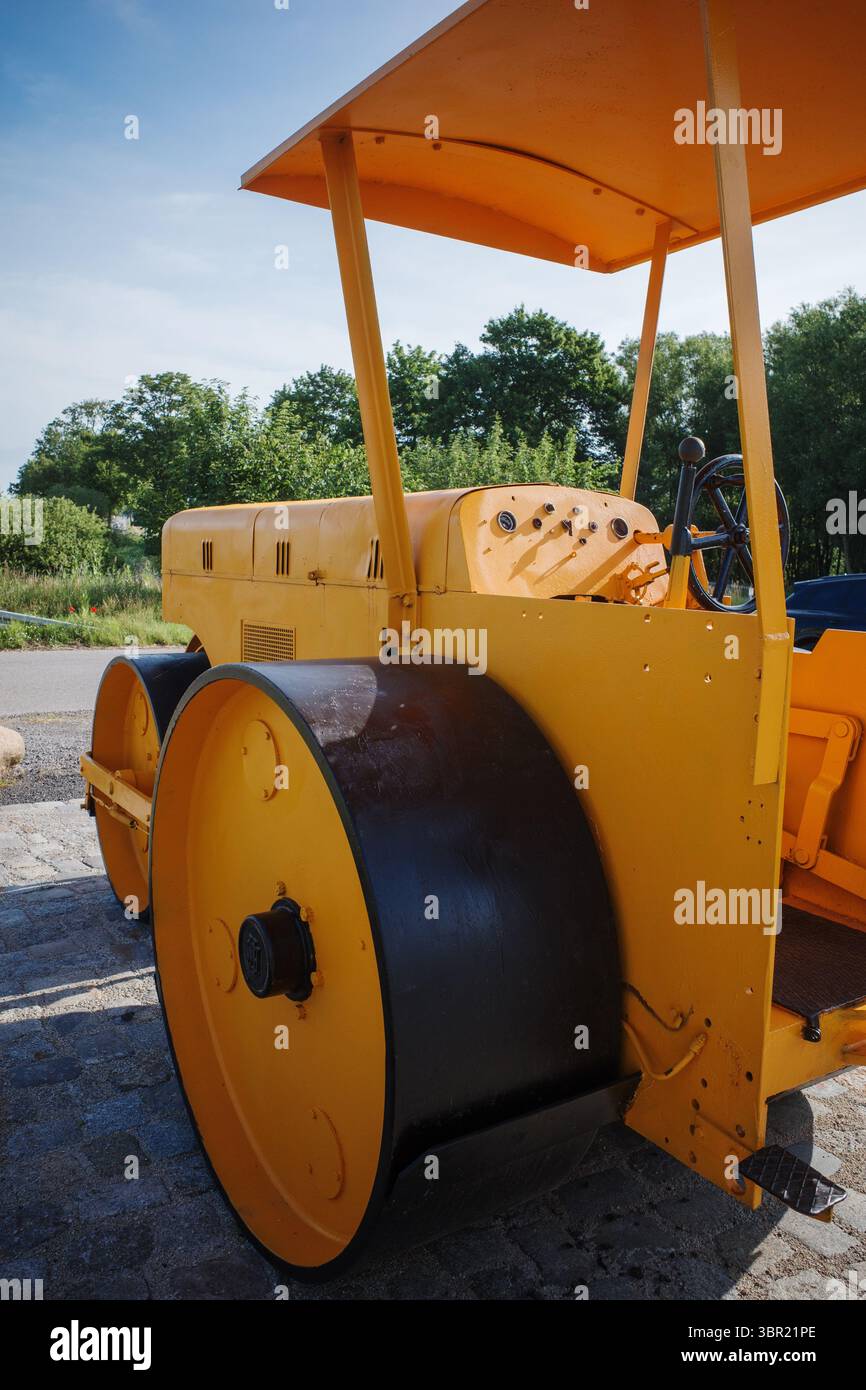 An old yellow historic levelling roller Stock Photo