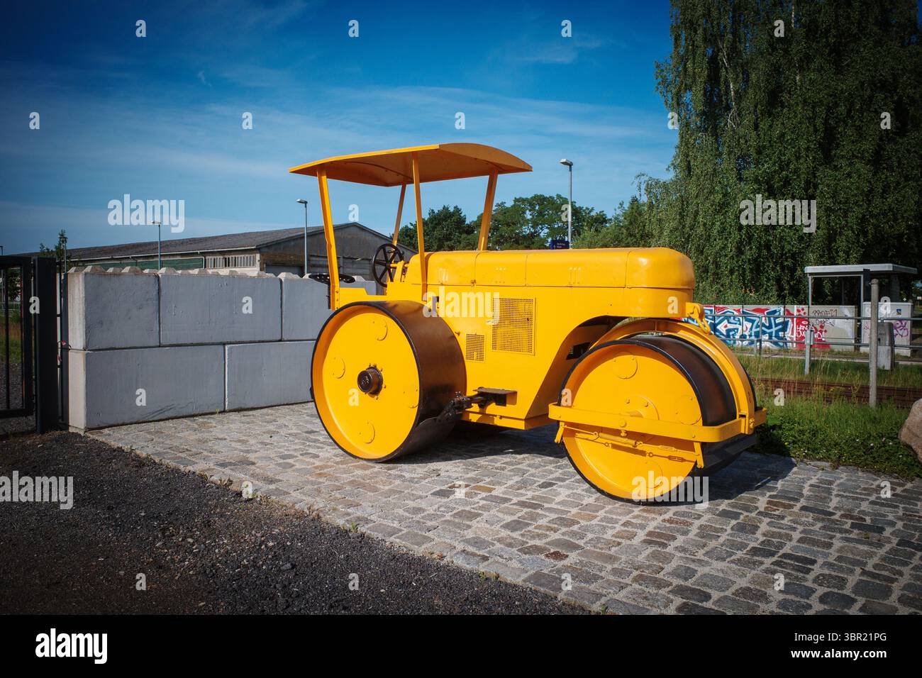 An old yellow historic levelling roller Stock Photo