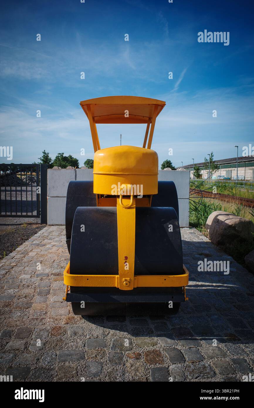An old yellow historic levelling roller Stock Photo