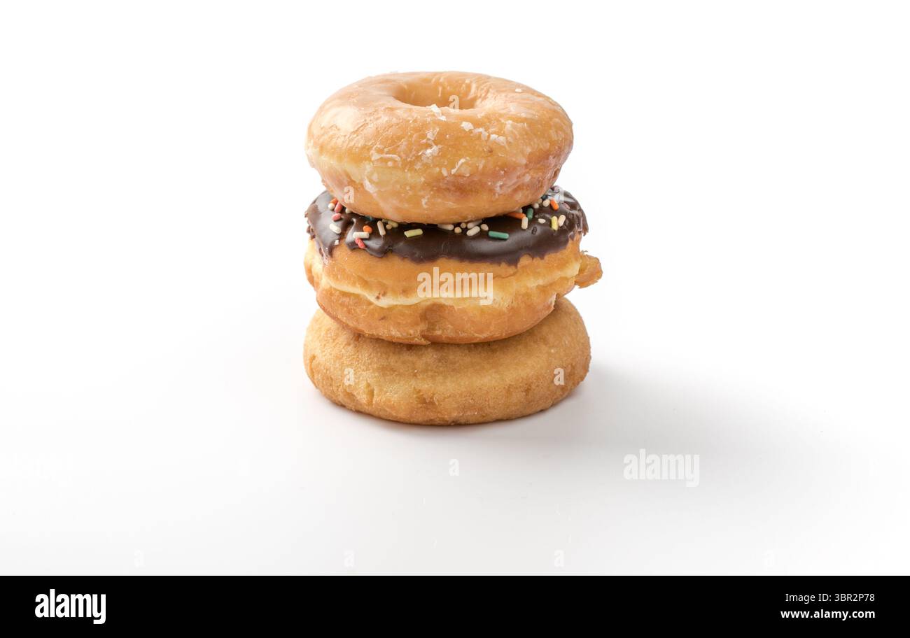tower of assorted donuts isolated on white background Stock Photo