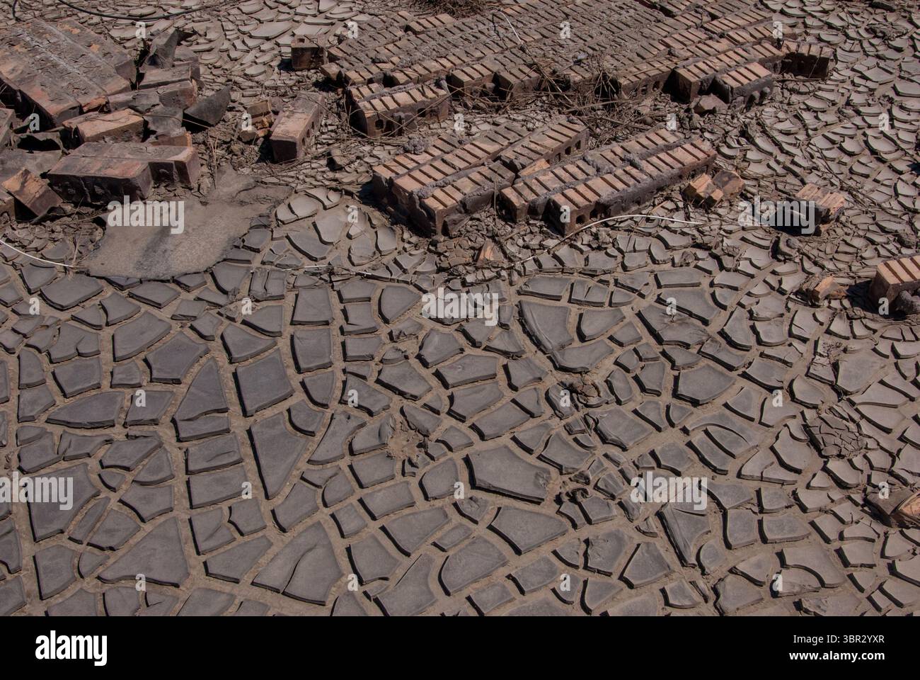 Bricks are scattered in the mud that Hurricane Ike created in September 2008. Stock Photo