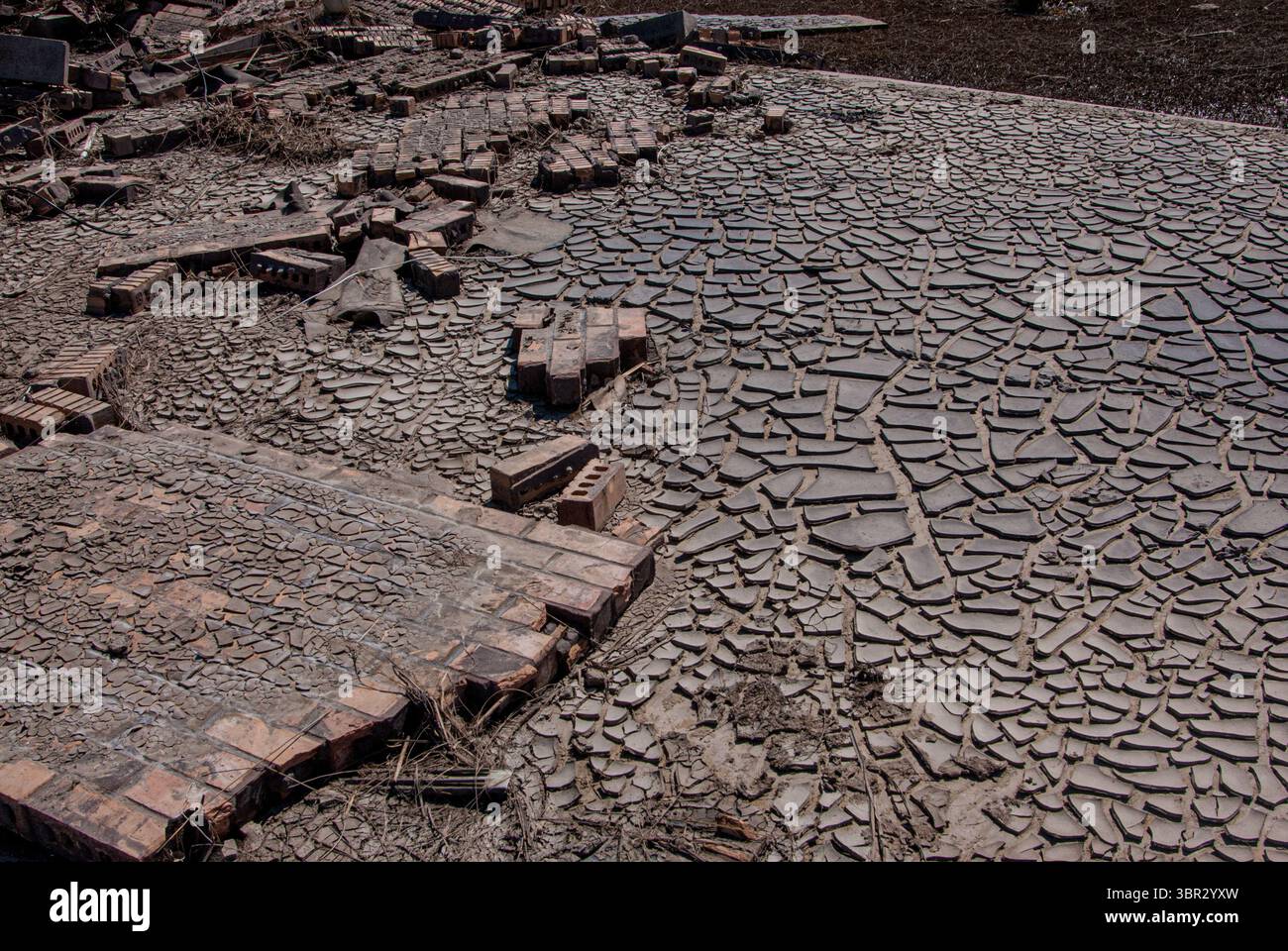 Bricks are scattered in the mud that Hurricane Ike created in September 2008. Stock Photo