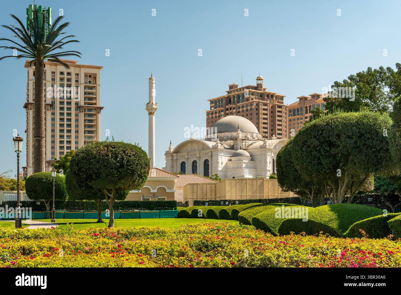 View of modern Buildings in Pearl island and Sheikh Hamad bin Jassim Mosque in view along the Persian Gulf. Stock Photo
