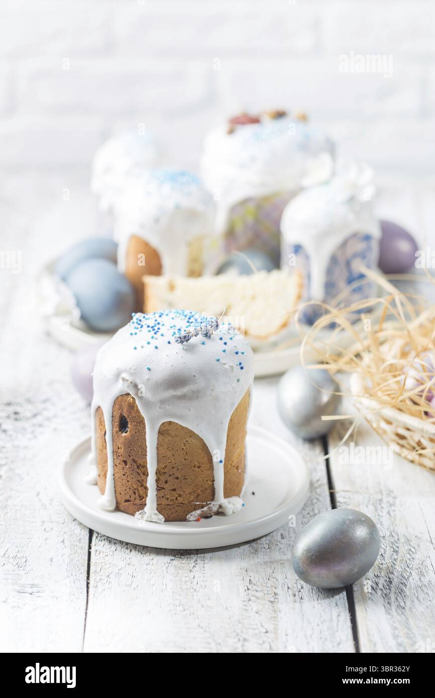 Easter table with Easter cakes and Easter eggs over white background Stock Photo
