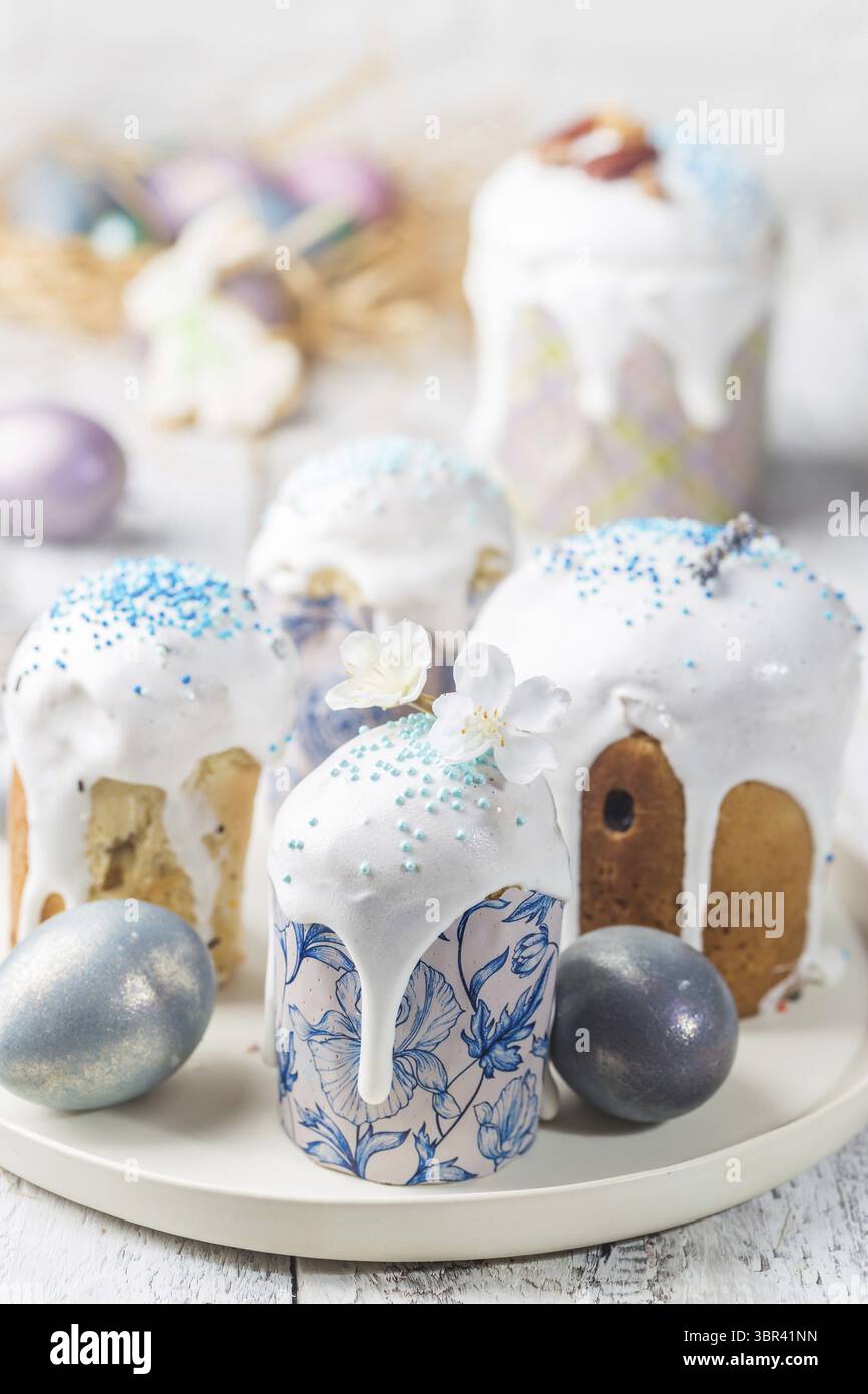Easter table with Easter cakes and Easter eggs over white background Stock Photo