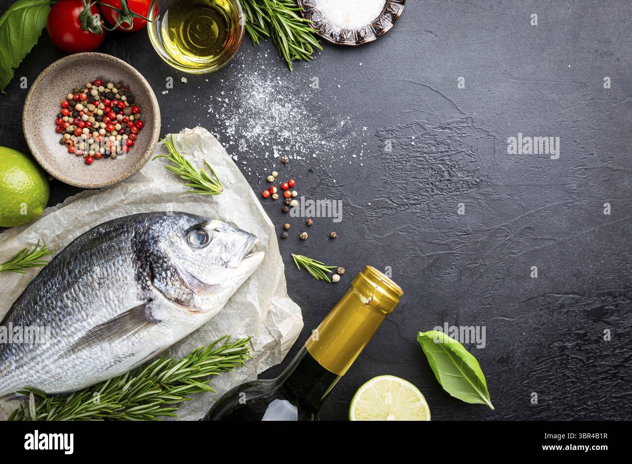 Fresh ready to cook raw bream fish dorado with ingredients and ...