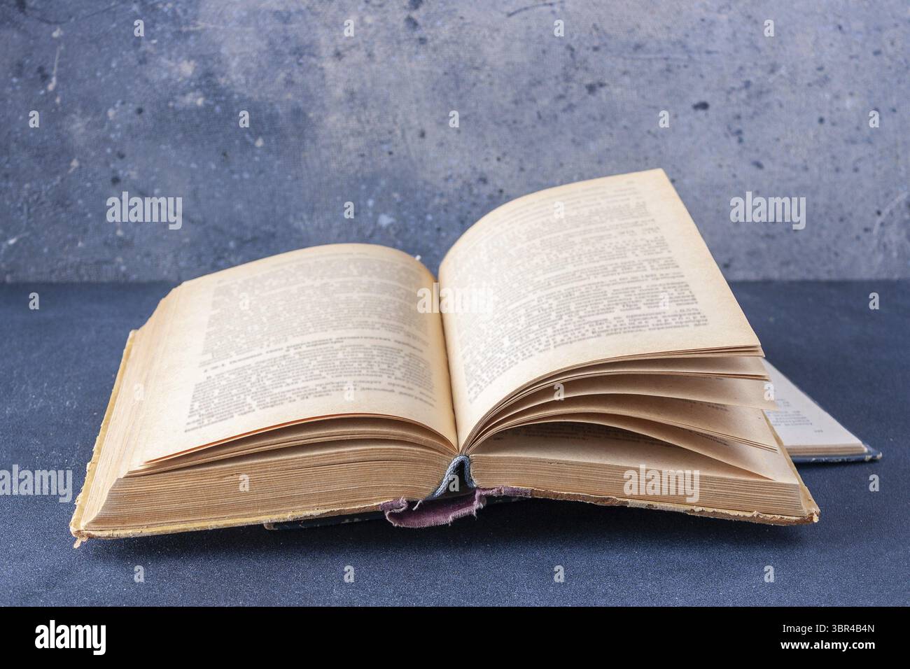 Open book on dark background with copy space Stock Photo
