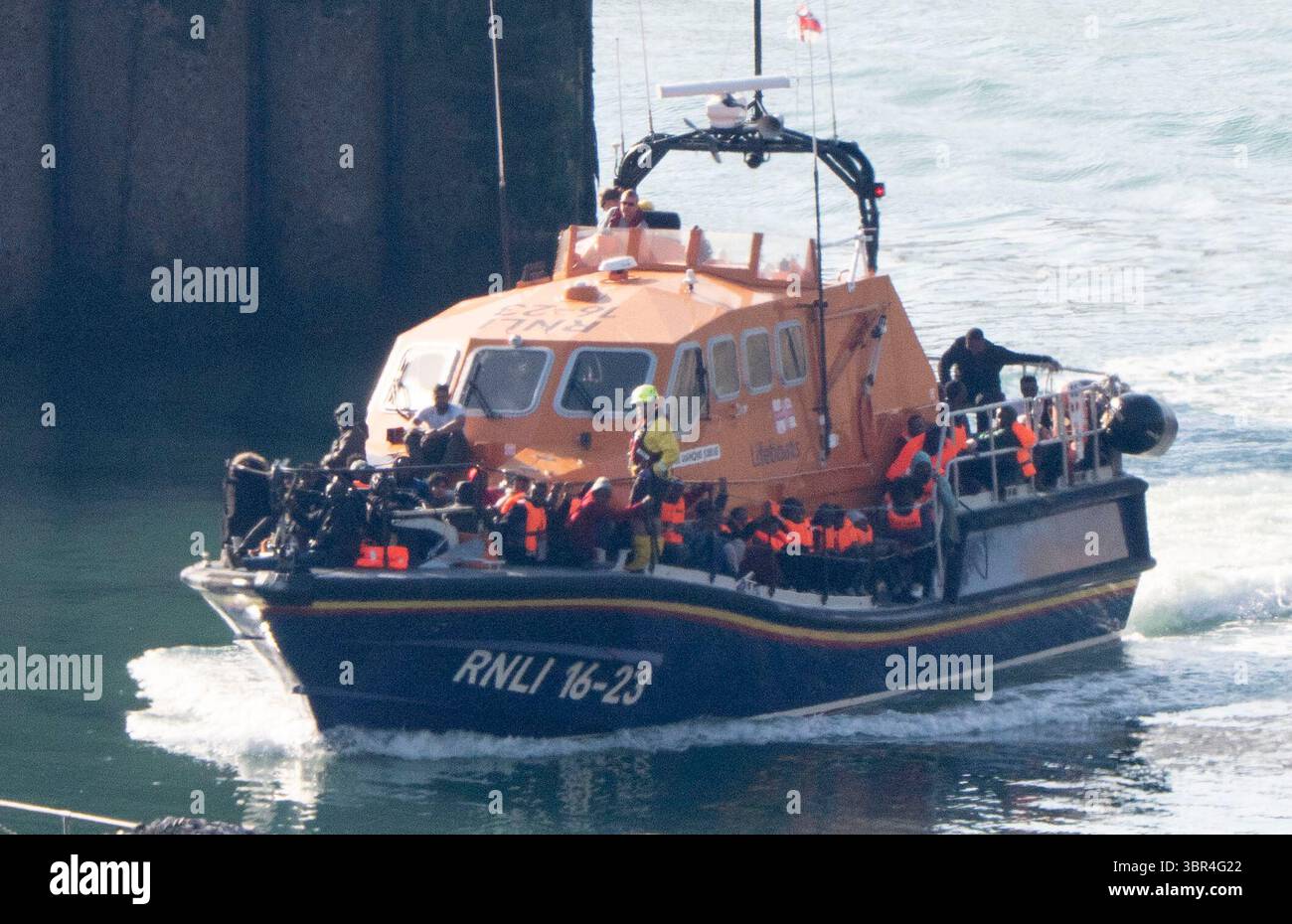 A group of people thought to be migrants are brought in to Dover, Kent, onboard an RNLI Lifeboat following a small boat incident in the Channel. Picture date: Friday July 11, 2025. Stock Photo