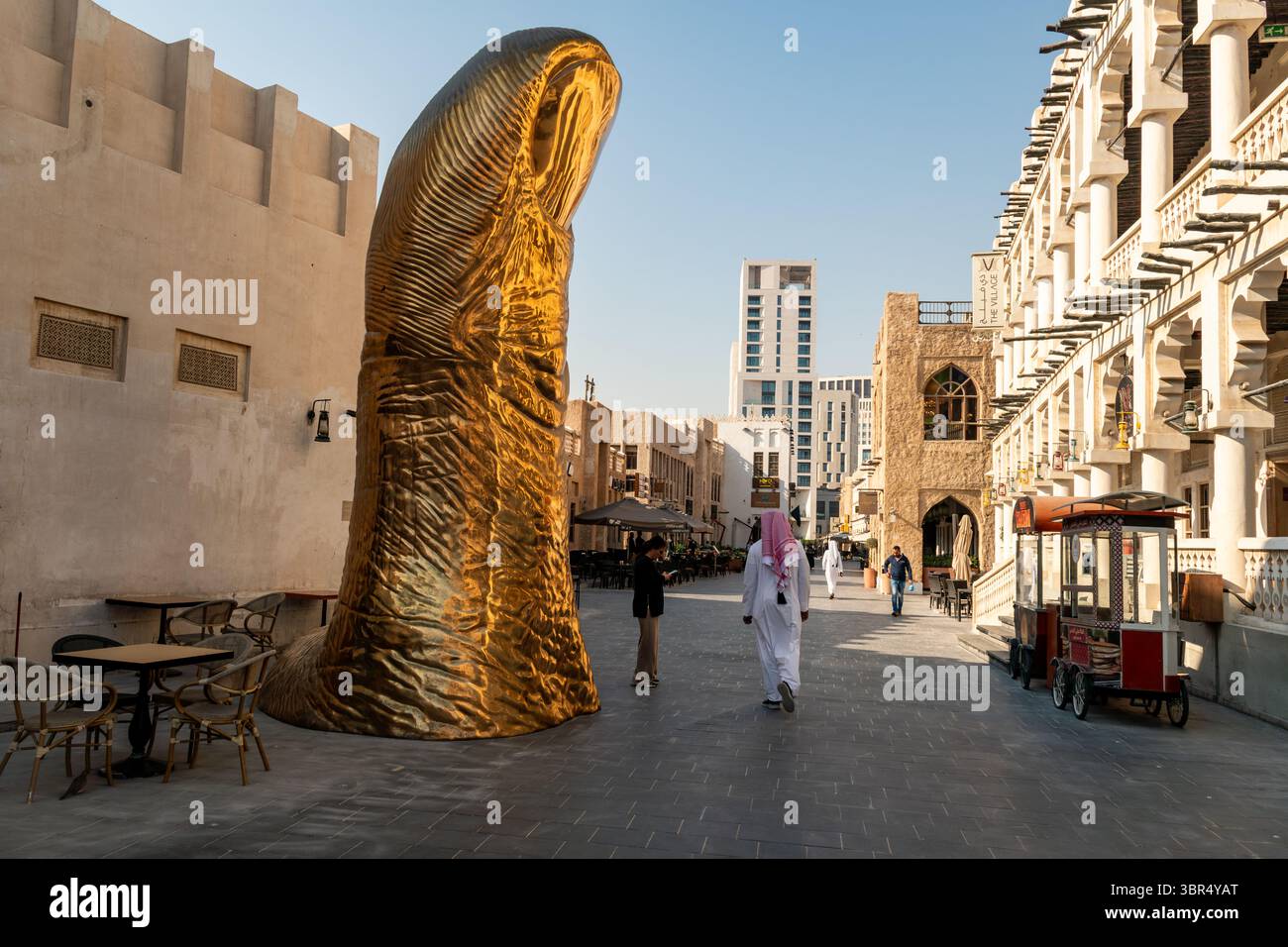Doha, Qatar, February 3, 2025: Souq Waqif area and thumb statue in Doha ...
