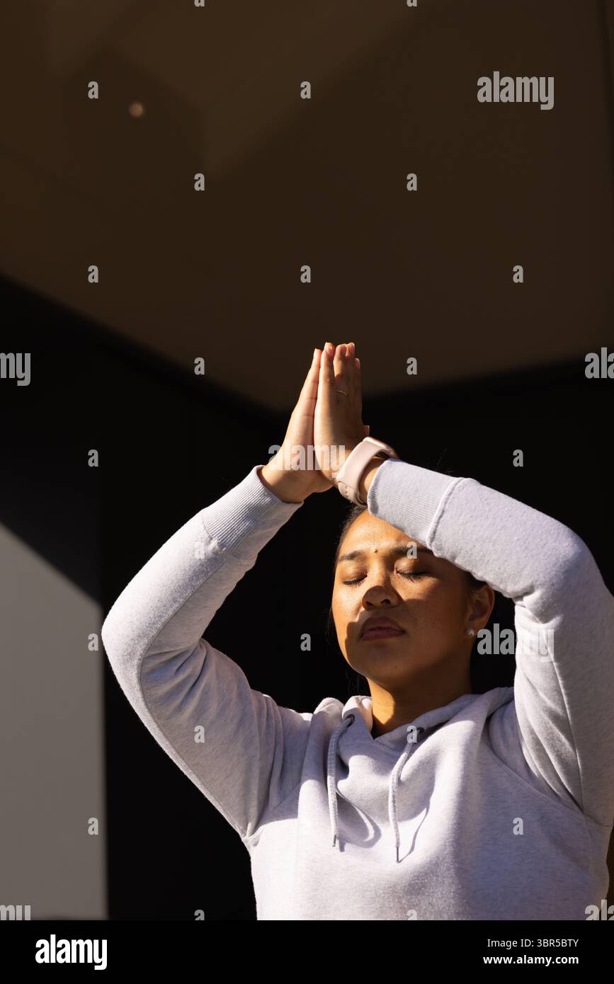 Praying woman in dark room hi-res stock photography and images - Alamy