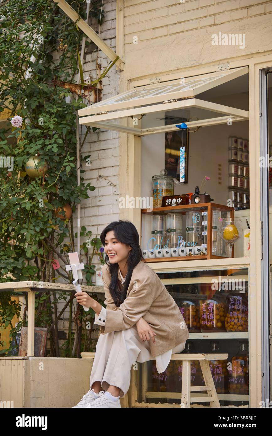 Happy chinese influencer woman hires stock photography and images Alamy