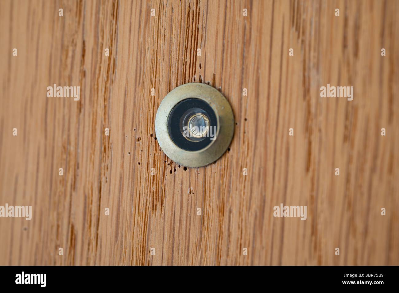 Apartment door peephole macro close up shot, no people Stock Photo