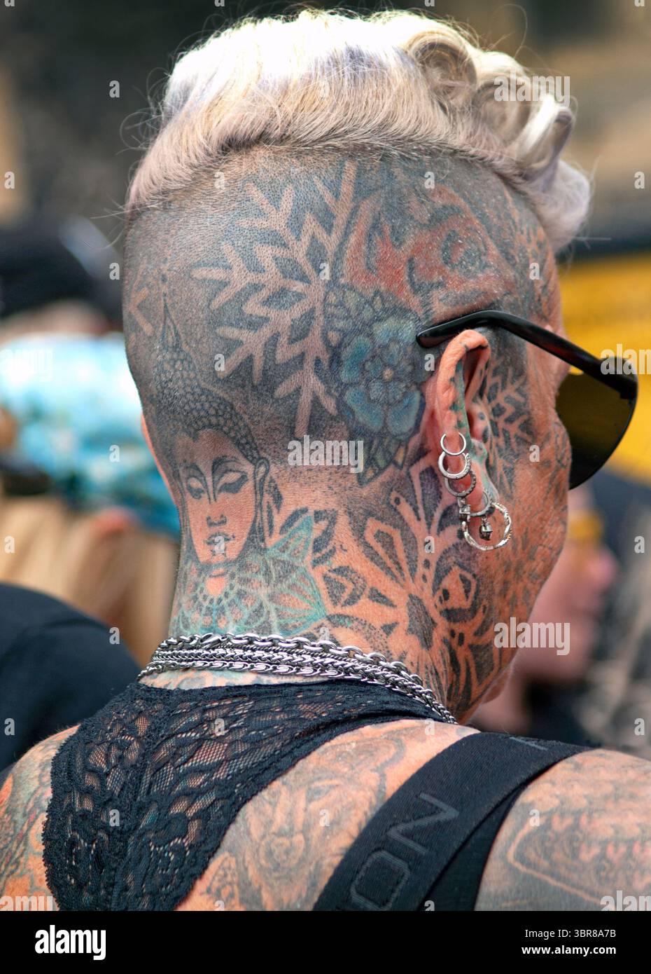 A woman's tattooed head in Brighton, England Stock Photo