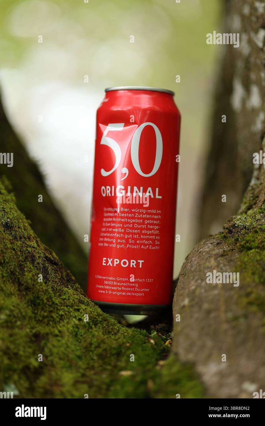Red can of 50 Original beer is sitting on a tree branch Stock Photo - Alamy