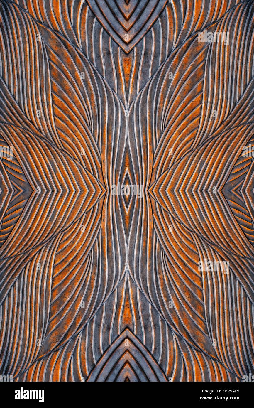 a textured metal surface featuring wavy, ribbed patterns. The metal has ...