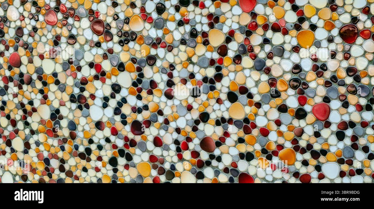 Wall decorated with colorful stone Stock Photo