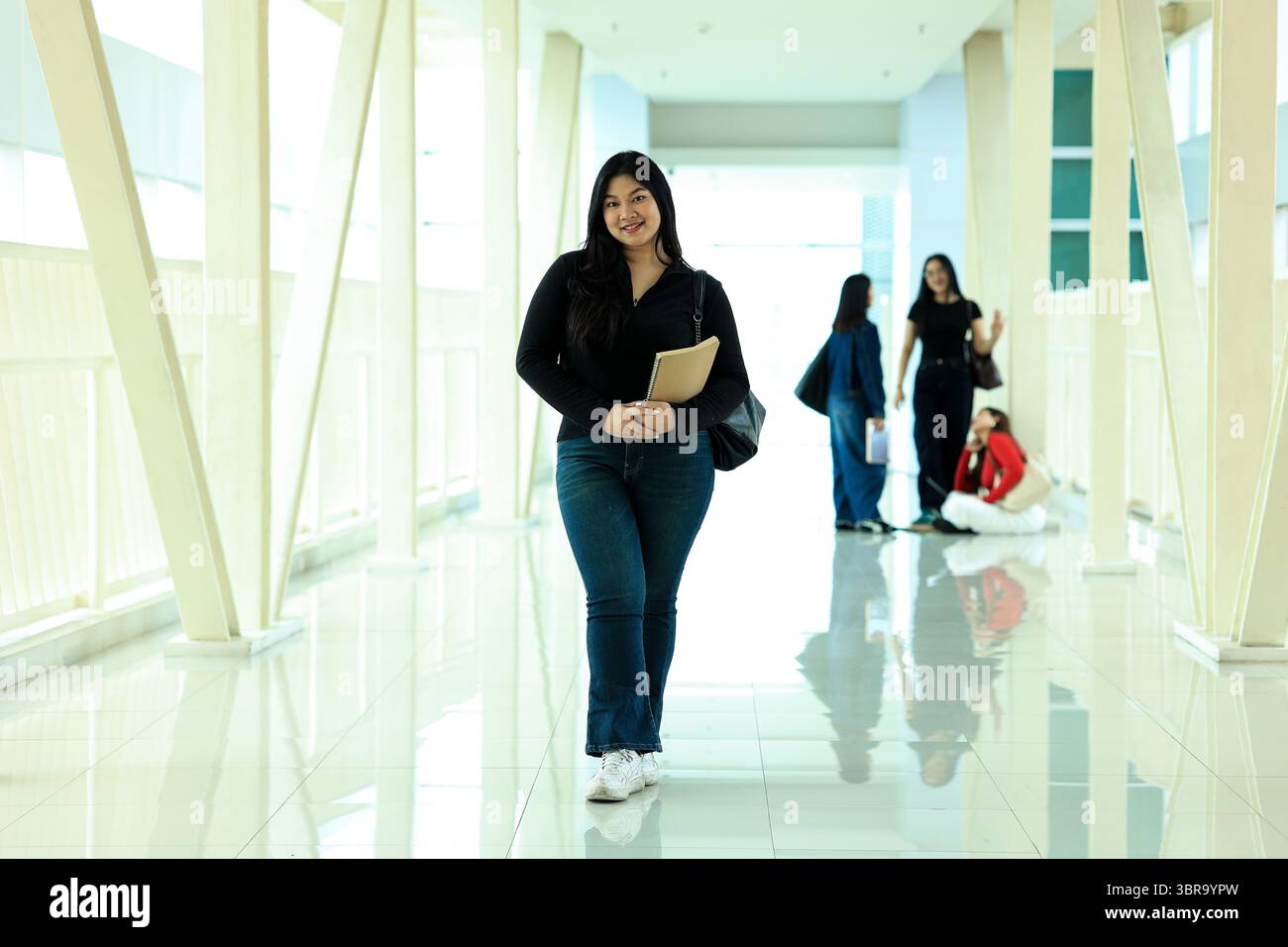 Portrait Confident Young Asian Female College Student Standing on Campus Hallway Stock Photo