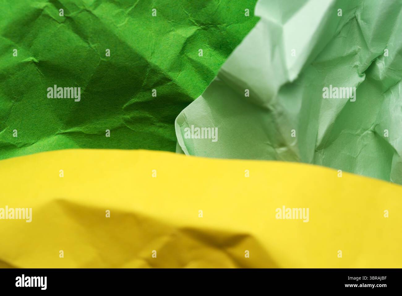 Colorful crumpled paper forms a textured, inviting composition. Stock Photo
